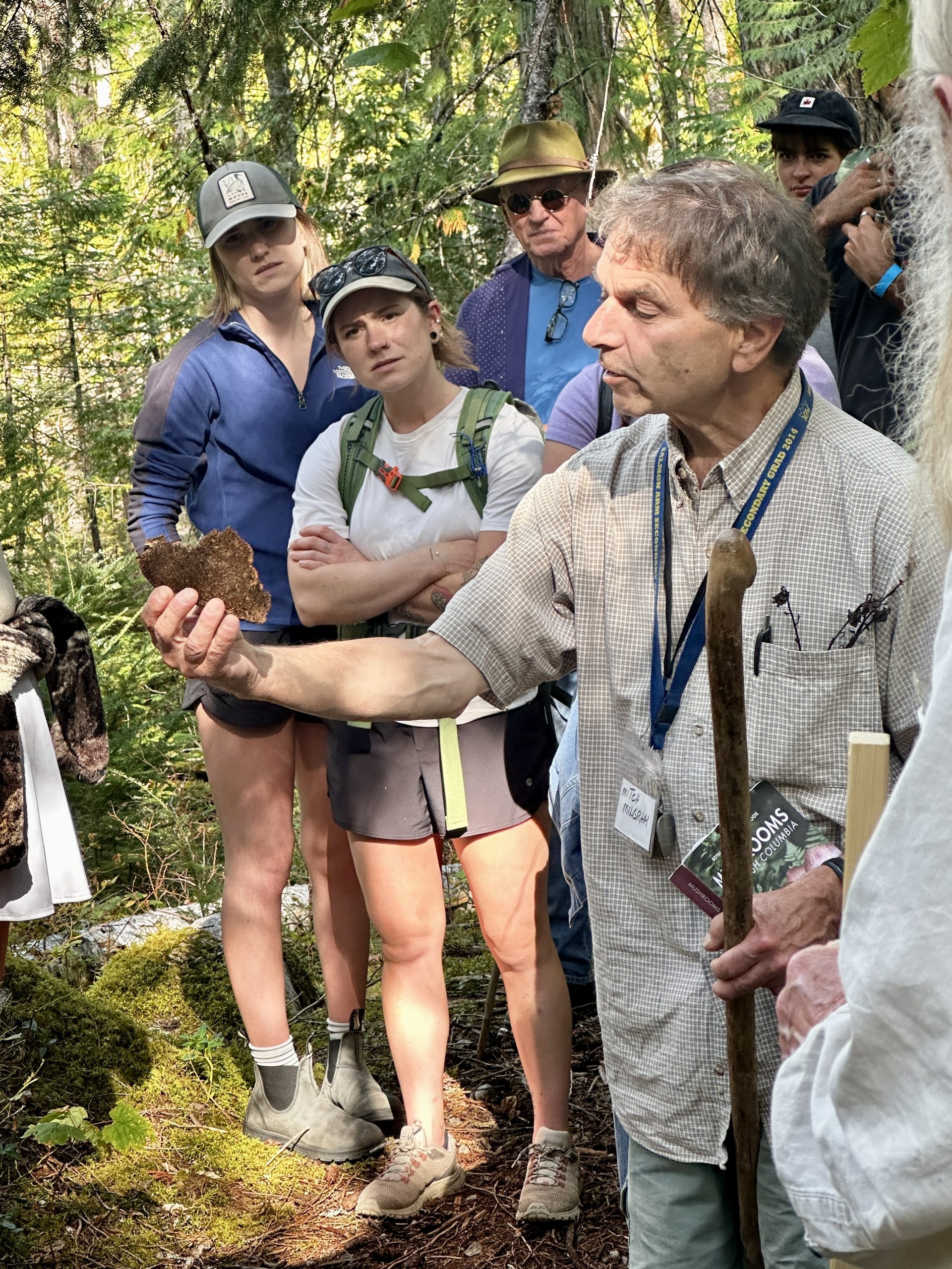 Fungi Experts showing a mushroom during the Short Walk at the 2025 Sicamous Fungi Festival in Sicamous, British Columbia